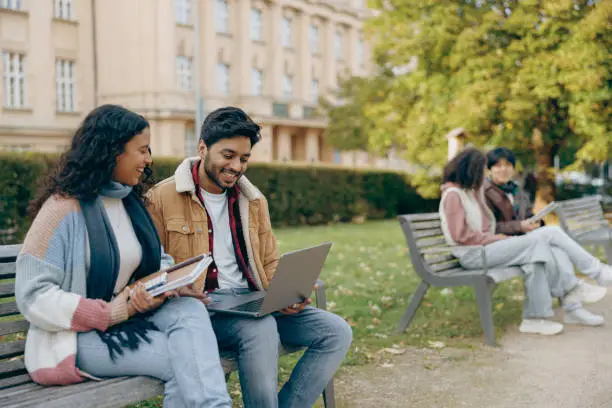 a calm student sitting outdoors